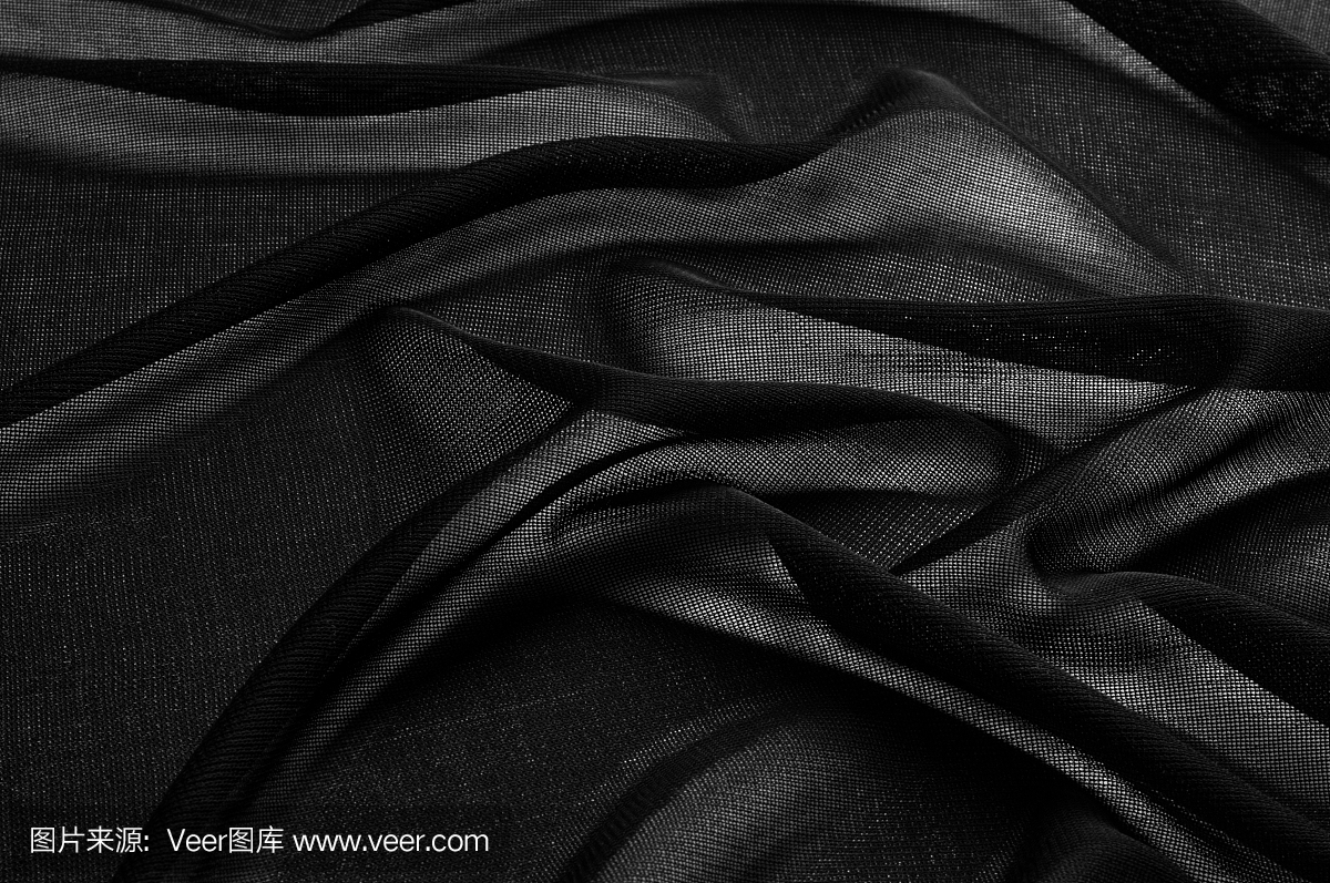 质地、背景、模式。黑色透明的织物。黑色网眼织物看通过透明弹性哥特朋克场景Emo时尚性感时尚透明覆盖四个方向伸展